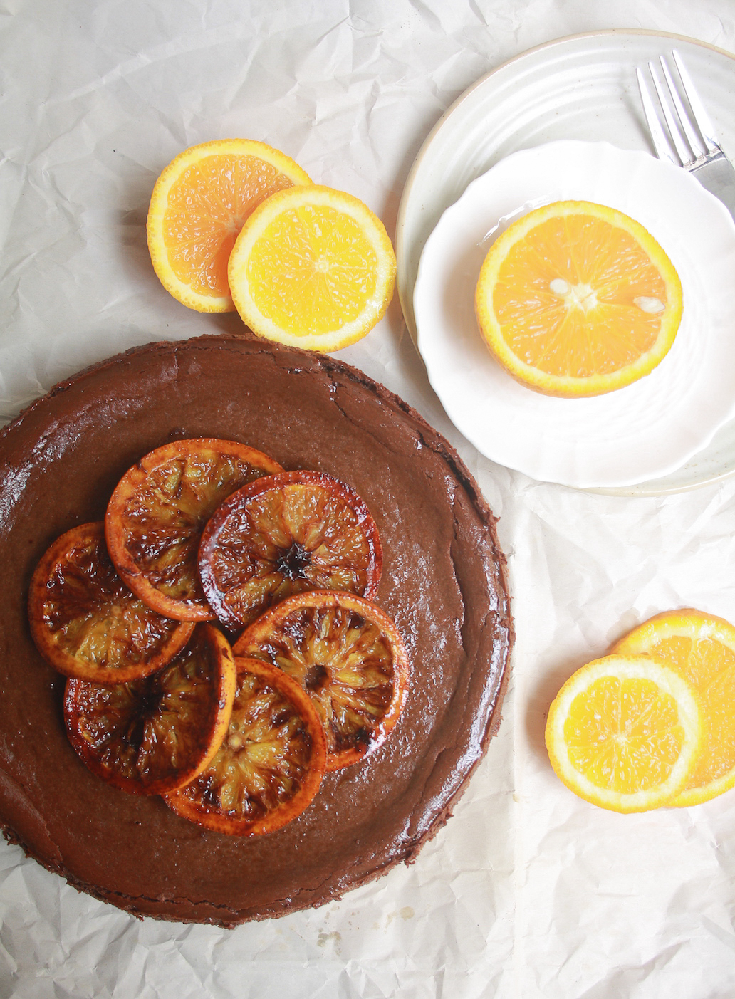 Dark, creamy, chocolate cheesecake spiked with fresh orange juice topped with caramelised orange slices. Rich and perfect!