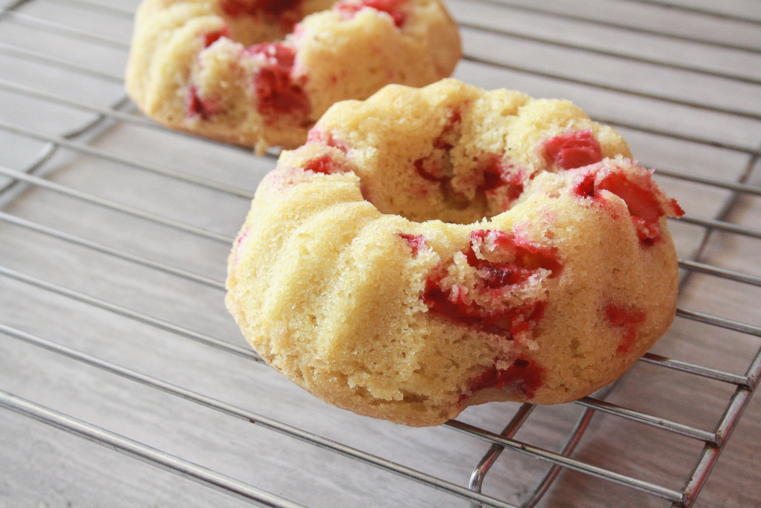 Soft, buttery bundt cakes filled with fresh strawberries and topped with a tangy, cinnamon-y compote!