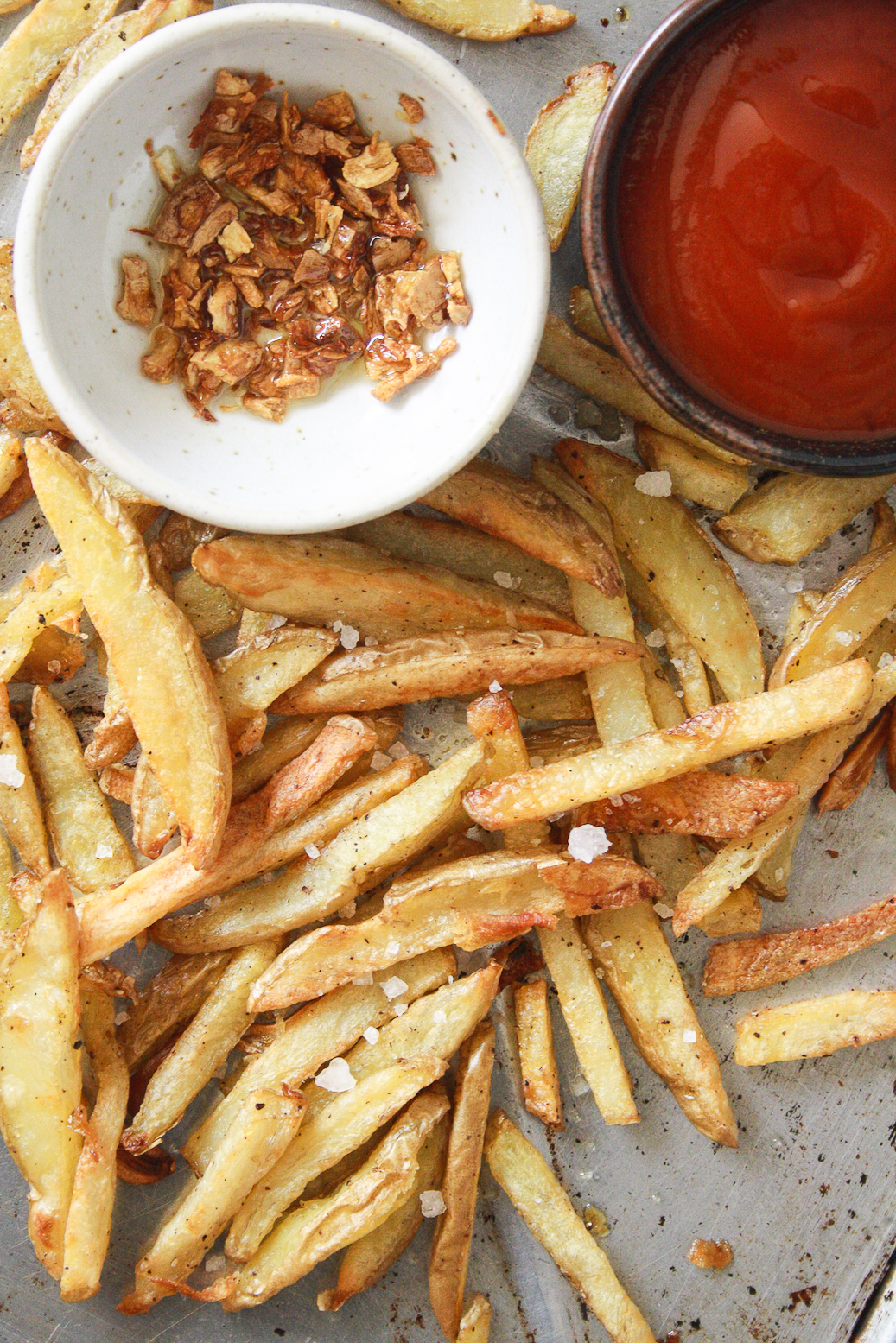 Crispy, salty fries with lots of garlic, baked not fried!