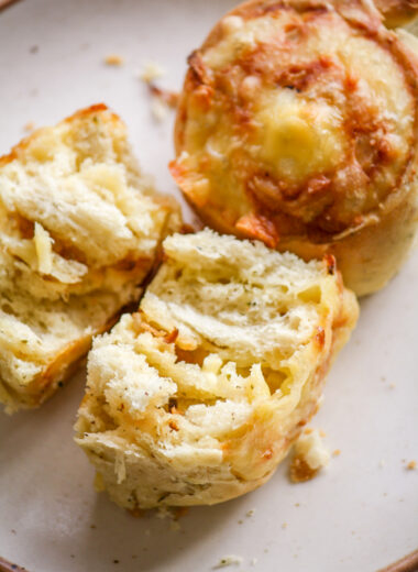 Soft and fluffy savoury rolls filled with cheddar cheese and caramelised onions!