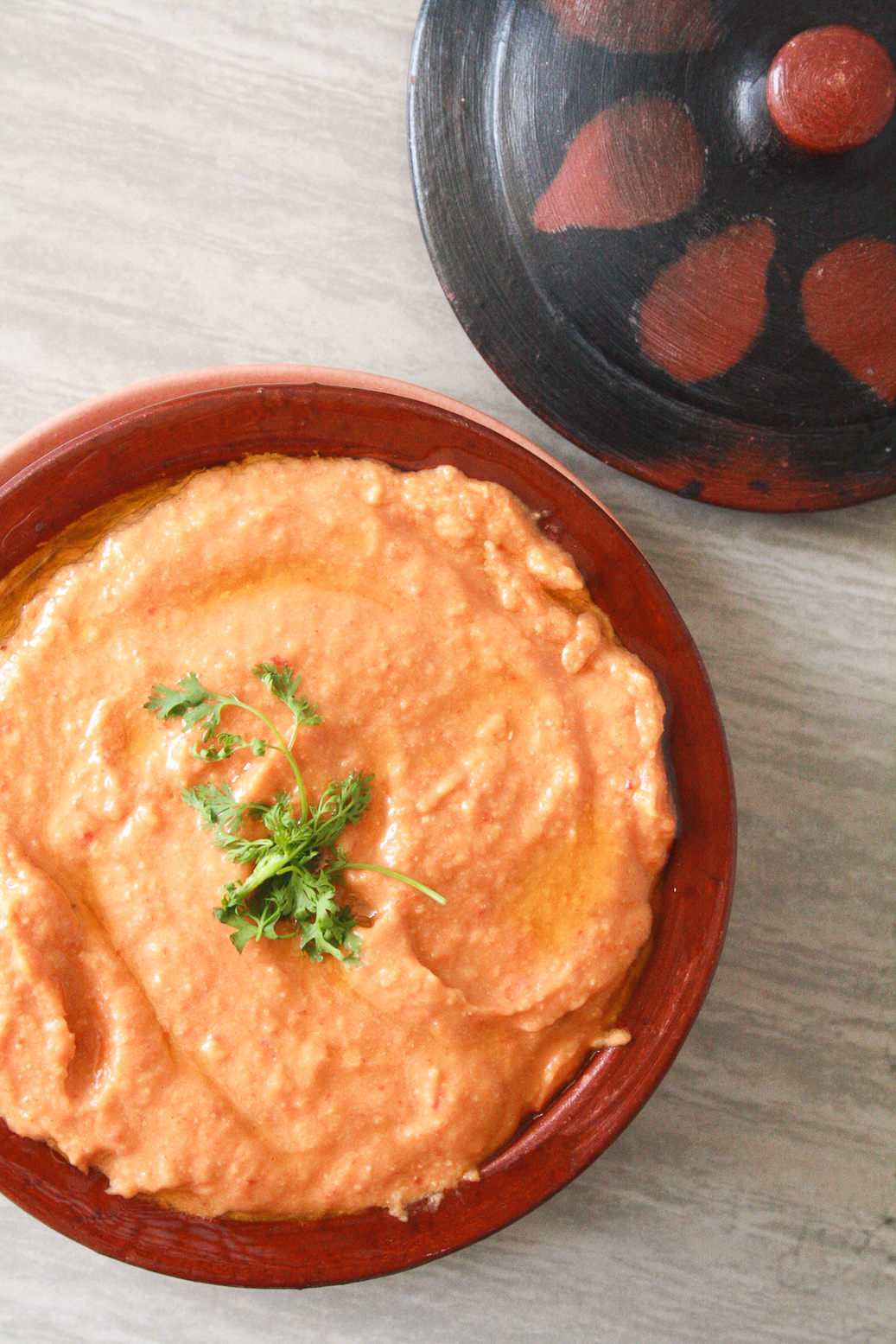 Classic hummus taken up a notch with juicy roasted peppers, served with soft and fluffy homemade pita!