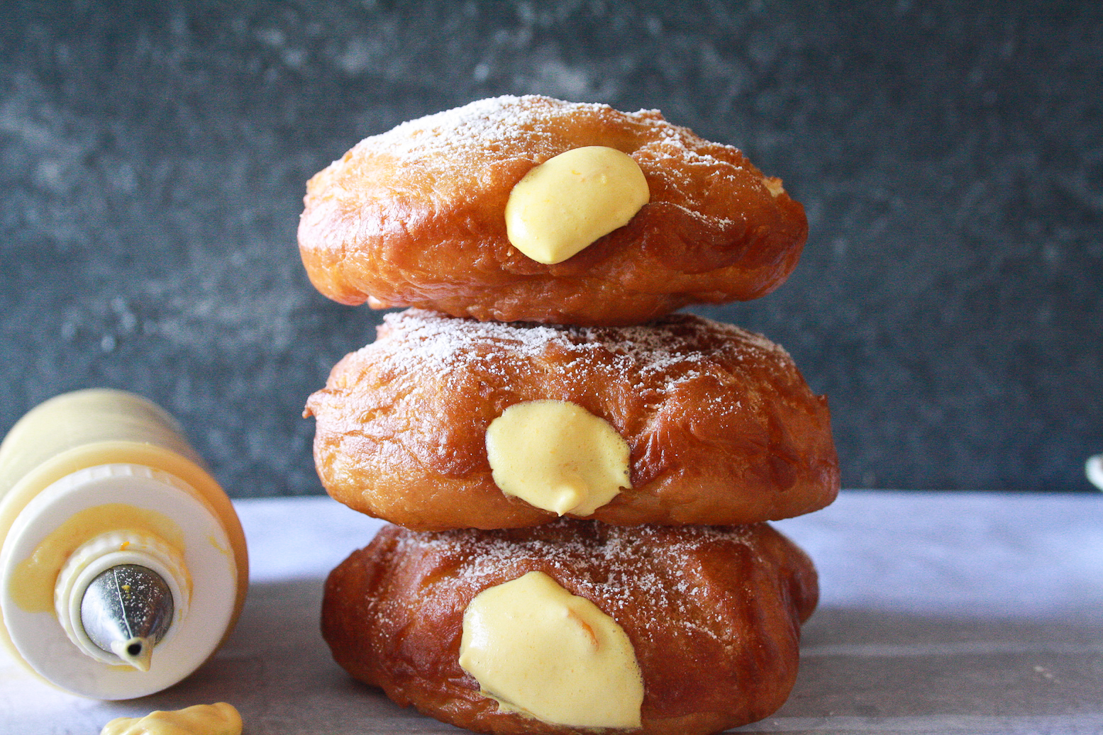 Soft, pillowy, buttery brioche donuts filled with fresh mango cream!