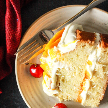 A classic, buttery, tender cake layered with tangy cream cheese frosting and lots of fresh mangoes!