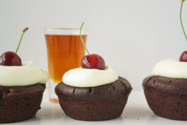 Rich, fudgy cakes filled with rum-soaked fresh cherries, served with a simple vanilla mascarpone topping!