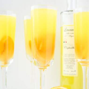 A refreshing, citrusy sangria with fresh peaches and limoncello!