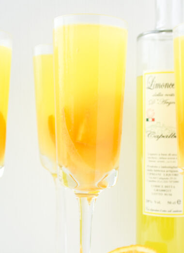 A refreshing, citrusy sangria with fresh peaches and limoncello!