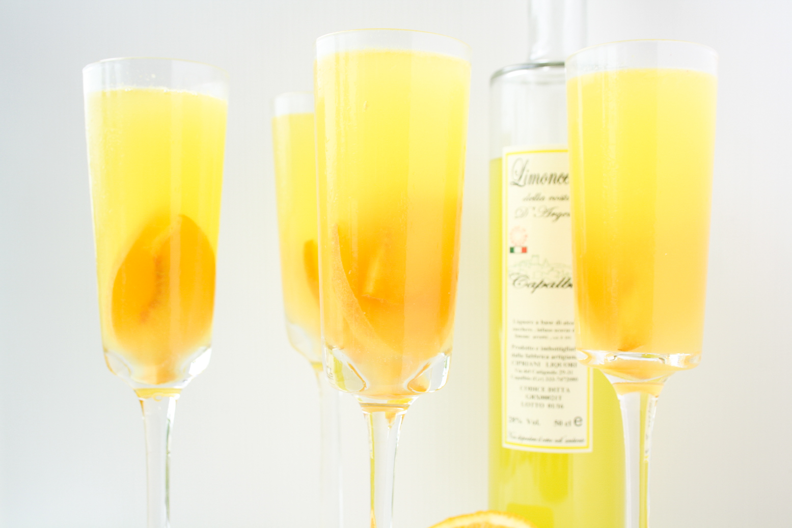 A refreshing, citrusy sangria with fresh peaches and limoncello!