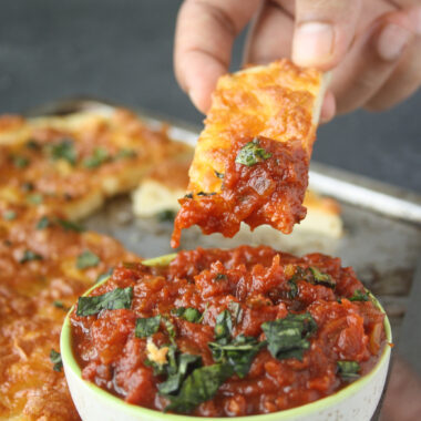 Chewy, buttery, cheesy, garlicky breadsticks with a chunky marinara sauce!