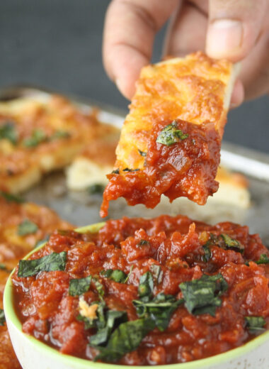 Chewy, buttery, cheesy, garlicky breadsticks with a chunky marinara sauce!