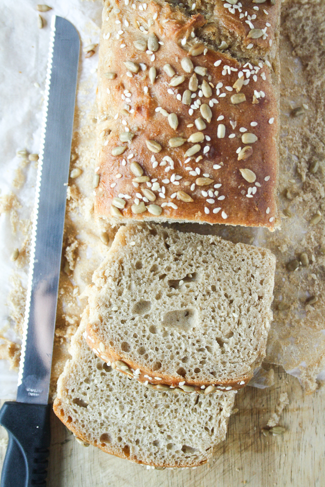 Soft and chewy homemade rye bread topped with sesame and sunflower seeds.