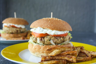Hearty burgers with sweet potato, quinoa and kidney beans, topped with a light and creamy tzatziki