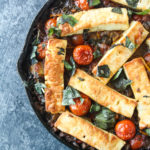 An easy baked dish with lots of fresh veggies, mushrooms and halloumi in a red wine sauce!