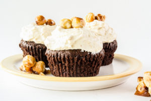 Tender chocolate cupcakes topped with a creamy hazelnut praline frosting!