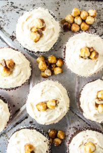 Tender chocolate cupcakes topped with a creamy hazelnut praline frosting!