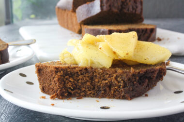 Moist, warmly spiced gingerbread cake with buttery apples cooked in whiskey!