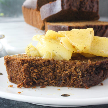 Moist, warmly spiced gingerbread cake with buttery apples cooked in whiskey!