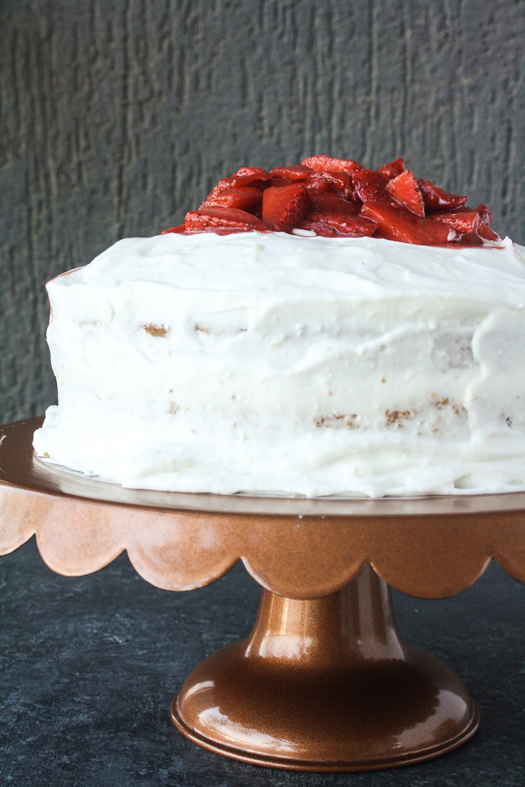 Tender butter cake layered with mascarpone cream frosting and juicy roasted strawberries!