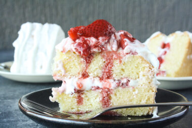 Tender butter cake layered with mascarpone cream frosting and juicy roasted strawberries!