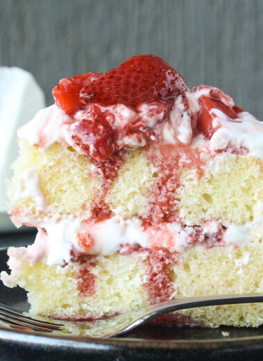 Tender butter cake layered with mascarpone cream frosting and juicy roasted strawberries!