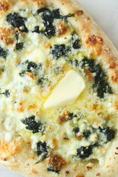 An eggless version of Khachapuri, a Georgian cheese-stuffed bread with spinach!