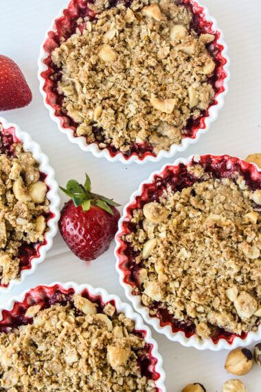 Juicy strawberries topped with a citrusy buckwheat hazelnut crumble!