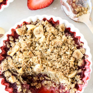 Juicy strawberries topped with a citrusy buckwheat hazelnut crumble!