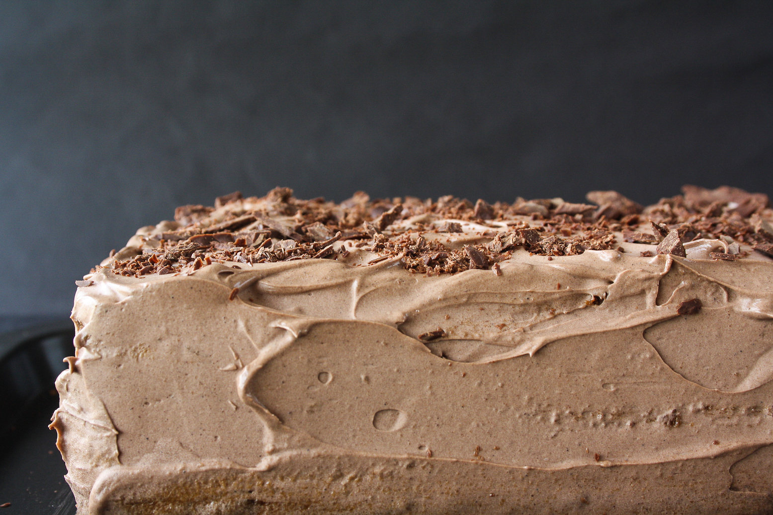 A decadent icebox cake with coffee-soaked glucose biscuits and silky chocolate frosting!