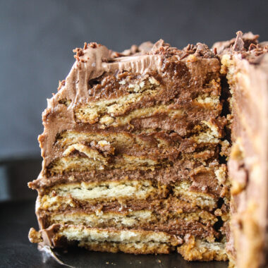 A decadent icebox cake with coffee-soaked glucose biscuits and silky chocolate frosting!