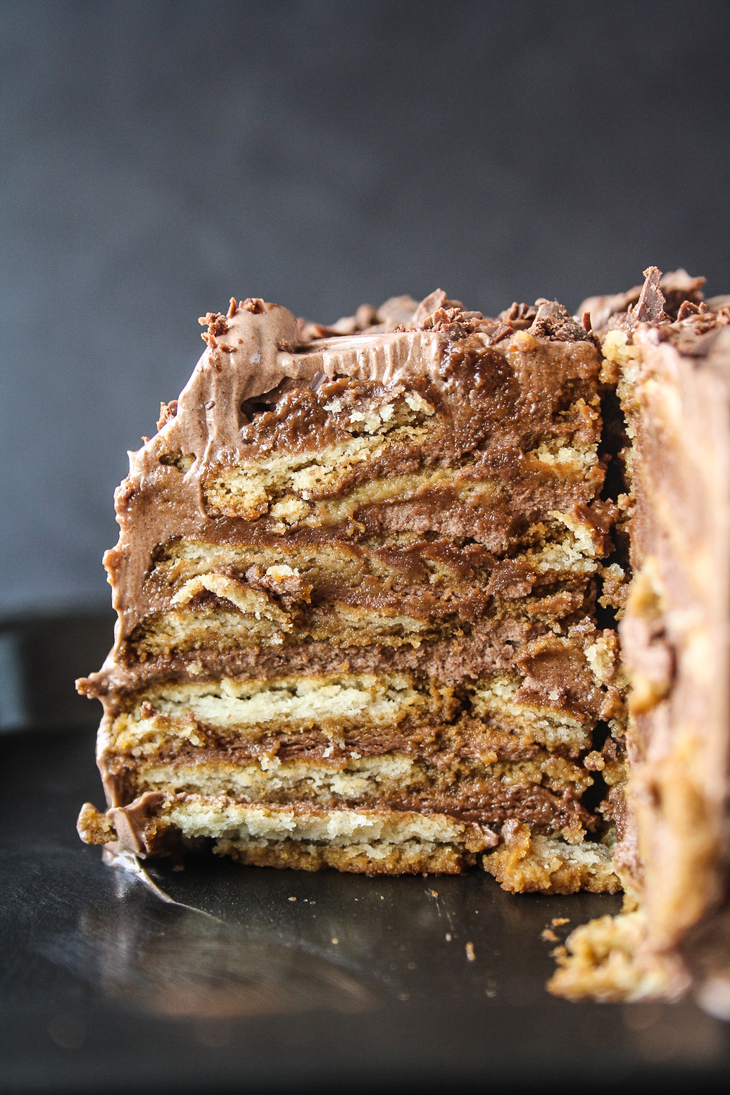 A decadent icebox cake with coffee-soaked glucose biscuits and silky chocolate frosting!