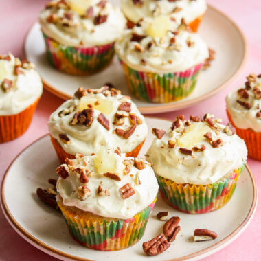 Moist and fruity banana, pineapple and coconut cupcakes with pecans and cream cheese frosting!