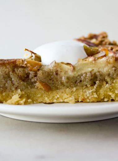 Almond frangipane tart with orange marmalade and sliced apples