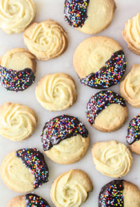 Crisp, buttery cookies dipped in melted chocolate and sprinkles