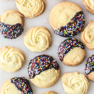 Crisp, buttery cookies dipped in melted chocolate and sprinkles