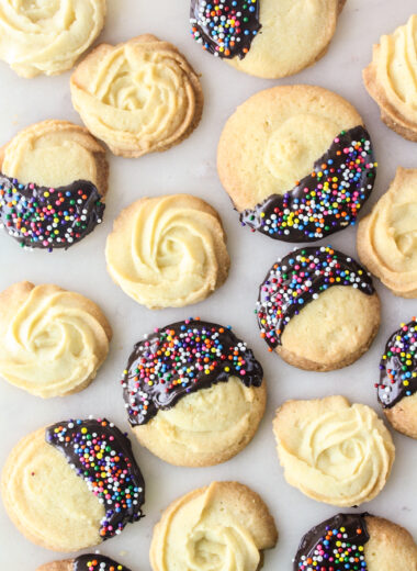 Crisp, buttery cookies dipped in melted chocolate and sprinkles