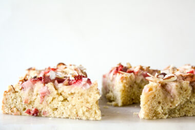 Tender almond and browned butter cake topped with fresh apples and strawberries