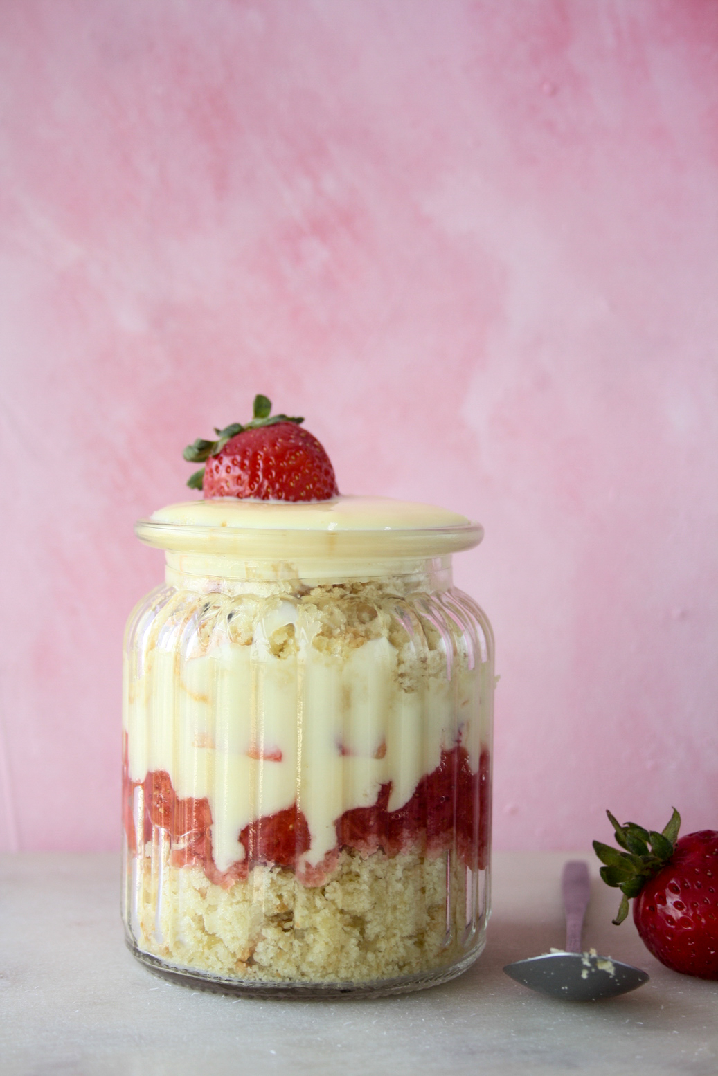 Easy trifle with layers of butter cake, eggless custard and strawberry compote!