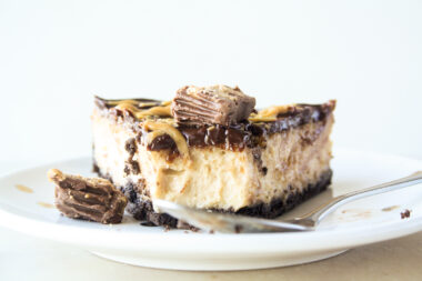 Creamy baked peanut butter cheesecake with Oreo crust and chocolate ganache