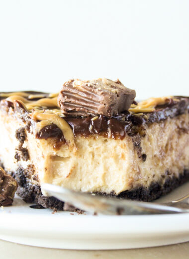 Creamy baked peanut butter cheesecake with Oreo crust and chocolate ganache