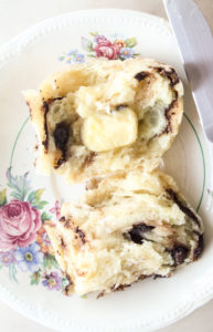 Soft and buttery hot cross buns with orange zest and chocolate chips