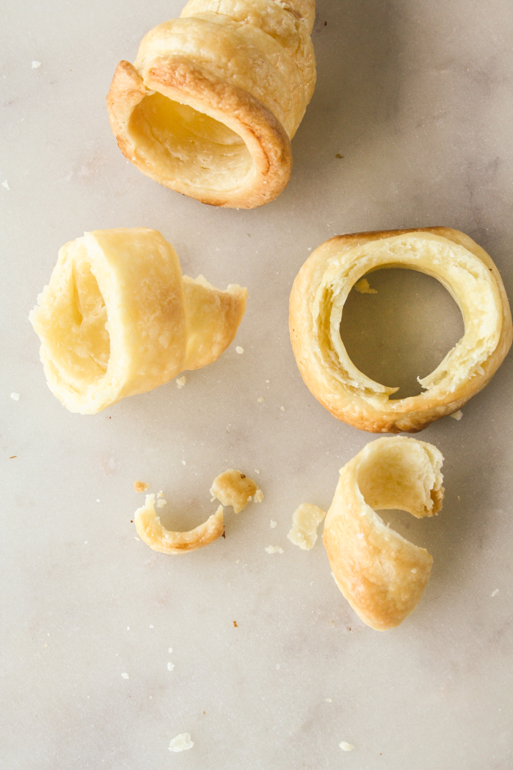 Homemade all-butter puff pastry rolls filled with vanilla whipped cream
