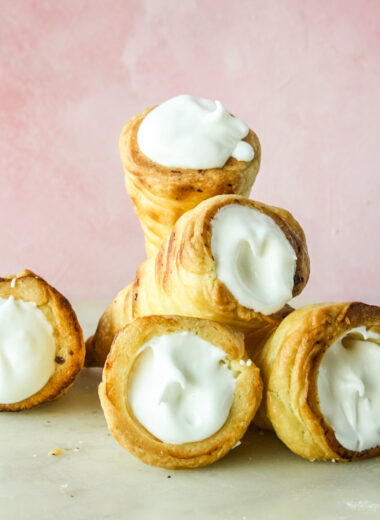 Homemade all-butter puff pastry rolls filled with vanilla whipped cream