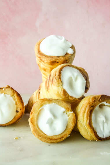Homemade all-butter puff pastry rolls filled with vanilla whipped cream