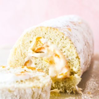 Light and fluffy roll cake with fresh mangoes and whipped cream