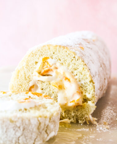 Light and fluffy roll cake with fresh mangoes and whipped cream