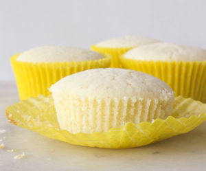 Moist lemon cakes with tangy cream cheese icing and blueberry compote