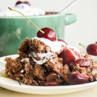 An easy, moist bread pudding with dark chocolate, fresh cherries and whipped cream