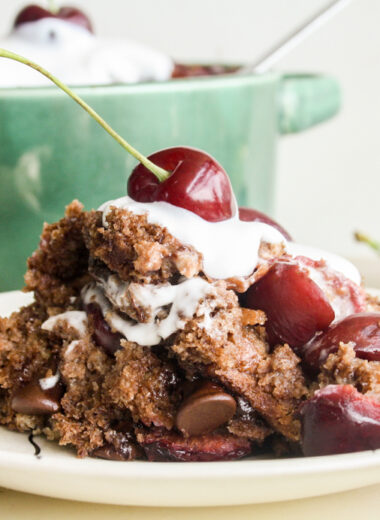 An easy, moist bread pudding with dark chocolate, fresh cherries and whipped cream