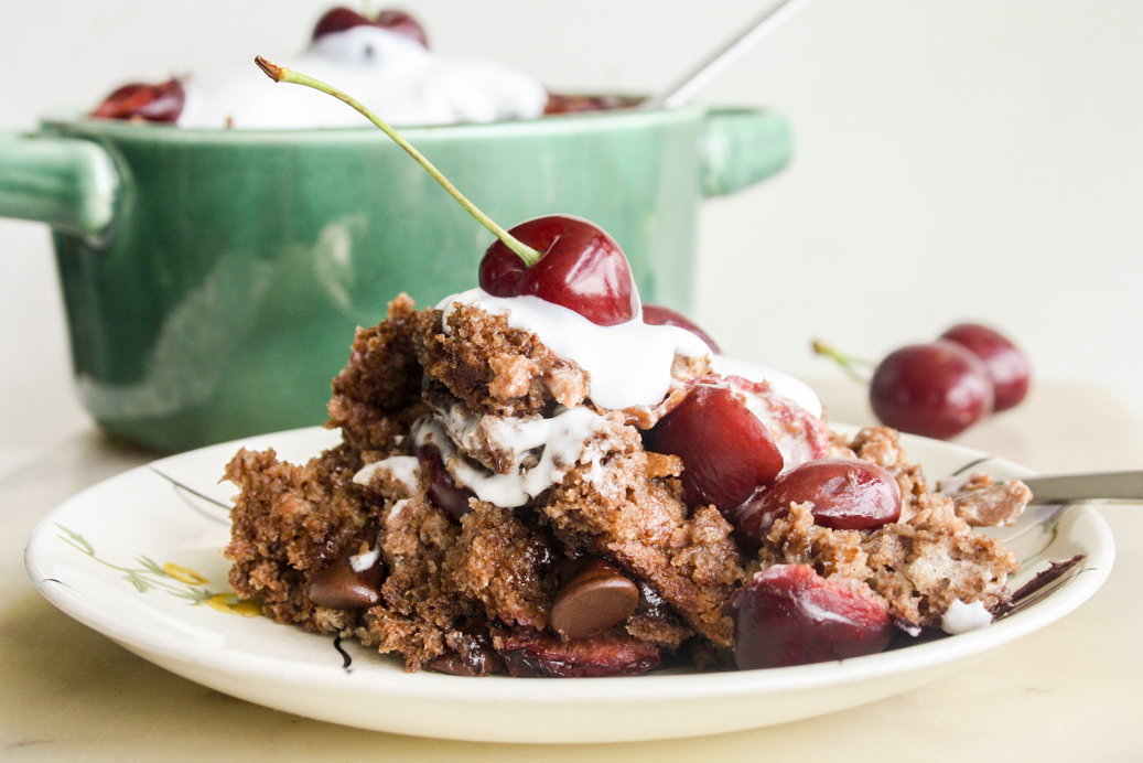 An easy, moist bread pudding with dark chocolate, fresh cherries and whipped cream
