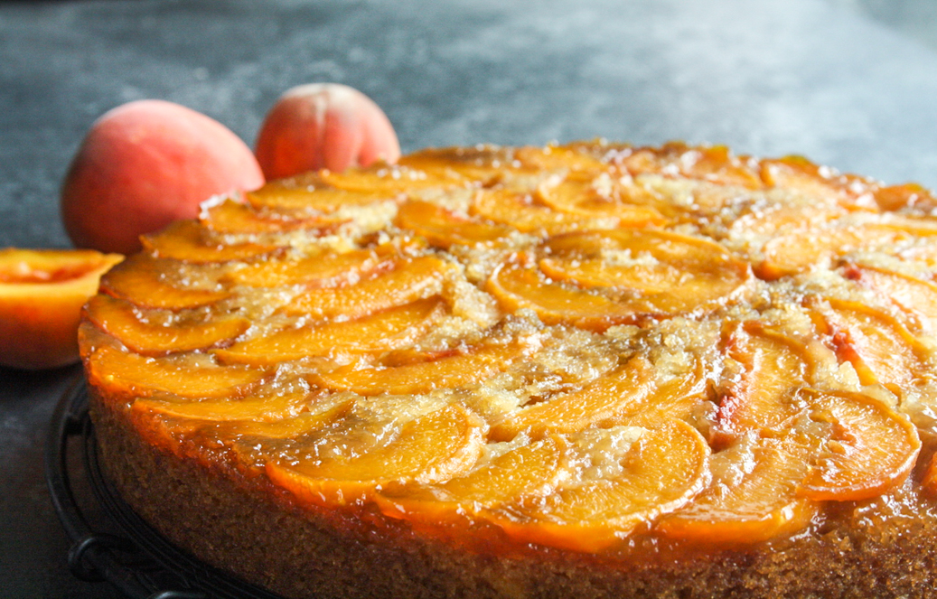 Moist and buttery cake with caramelised peaches on top