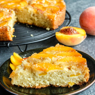 Moist and buttery cake with caramelised peaches on top